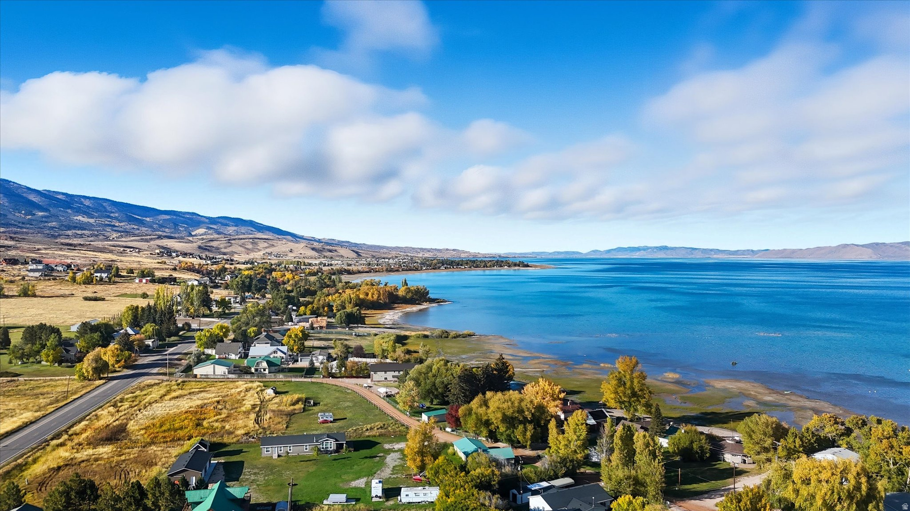 Garden City shoreline along Bear Lake with mountains rising to the west on an autumn afternoon